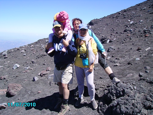 On her first visit to Etna's summit craters, the volcanologist's daughter fell asleep on his shoulders