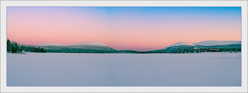 fells behind the frozen lake