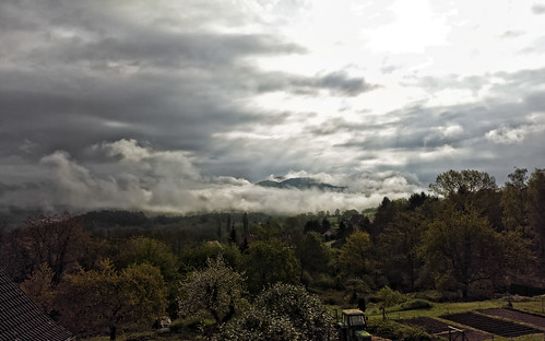 Moutains sun and clouds