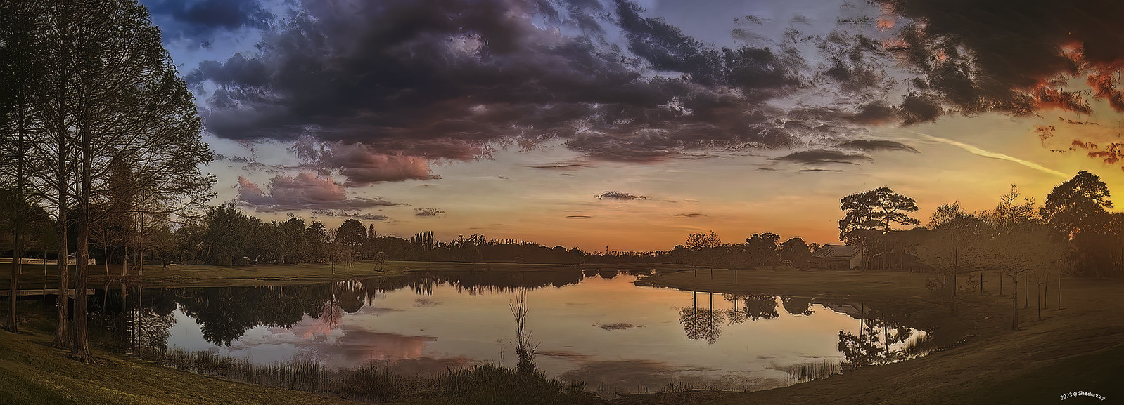 A sunset over a pond