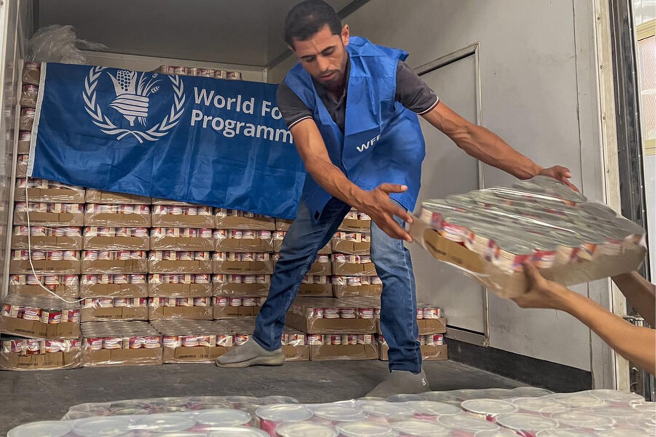 A man unloading food rations from a truck in Egypt.